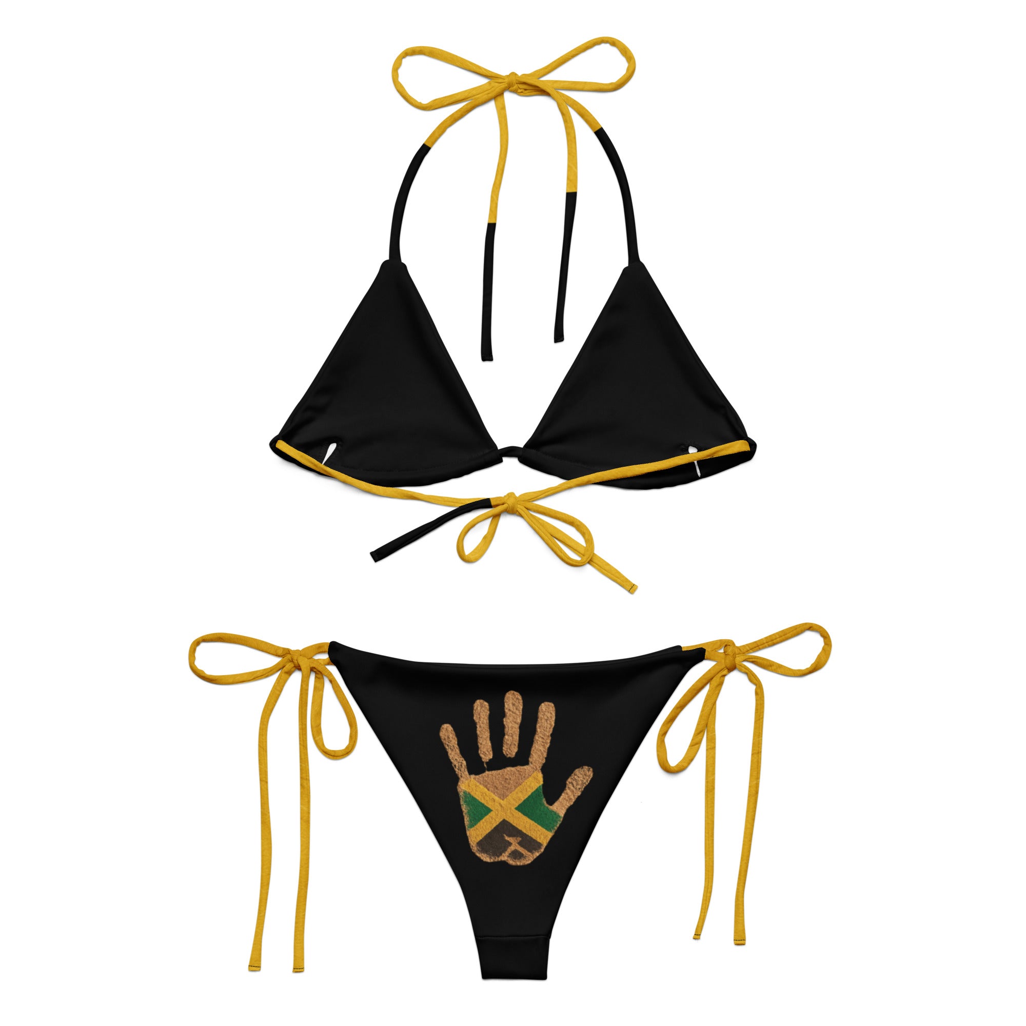 Black string bikini set with yellow ties and Jamaican flag handprint design on bottoms, isolated on white.