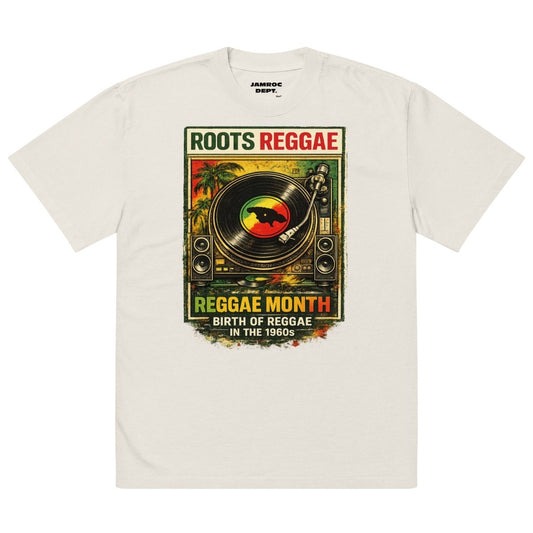 White t-shirt with colorful Roots Reggae Month graphic featuring a turntable, palm trees, and Jamaican flag design.