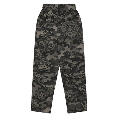 Black camo streetwear pants with crowns, fleur-de-lis, and coordinates graphic print.
